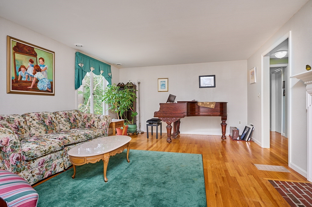 33 Echo Hill Road Amherst, MA 01002 - Photo 4 of 37 a living room with furniture and a rug
