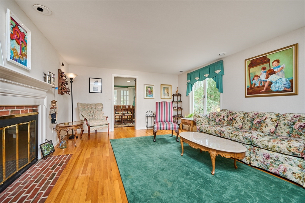 33 Echo Hill Road Amherst, MA 01002 - Photo 5 of 37 a living room with furniture and a fireplace