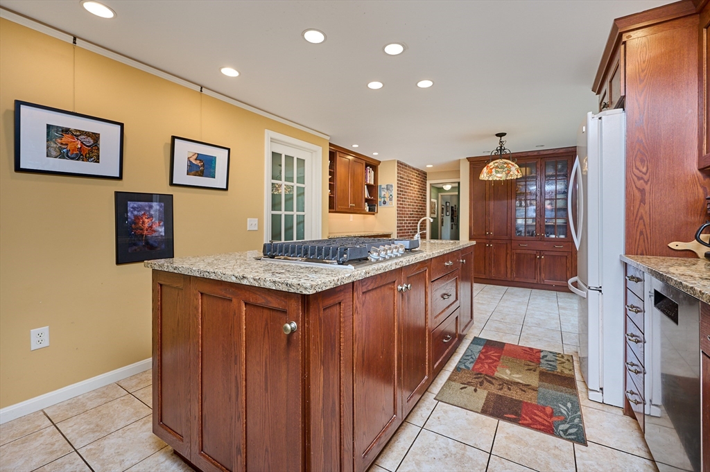 33 Echo Hill Road Amherst, MA 01002 - Photo 10 of 37 a large kitchen with stainless steel appliances granite countertop a stove and a refrigerator