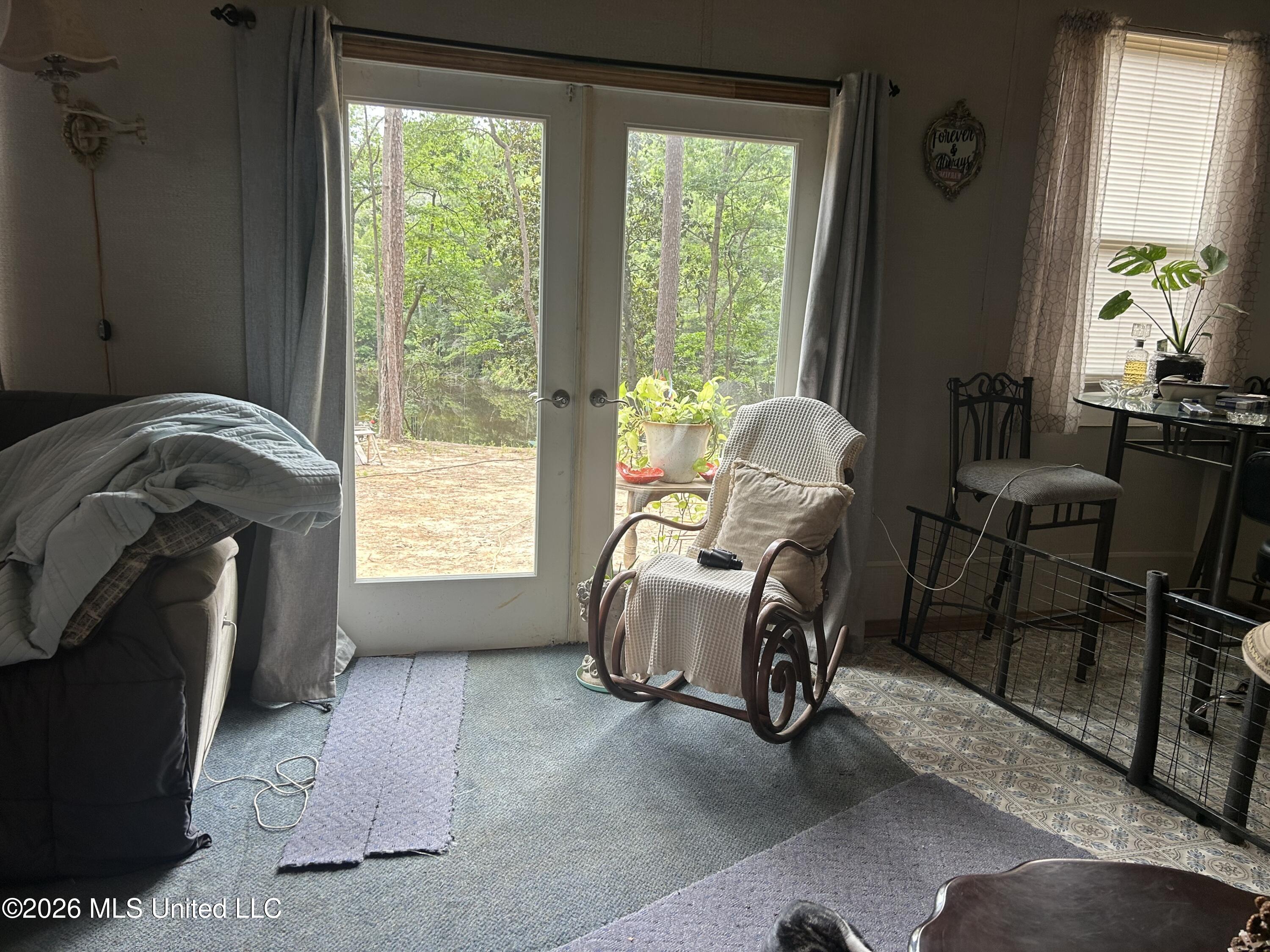 211 Clark Cemetery Road Laurel, MS 39443 - Photo 9 of 19 steve livingroom to outside