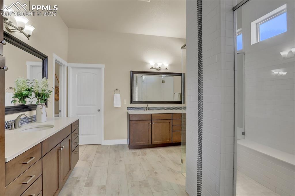 1435 Catnap Lane Monument, CO 80132 - Photo 16 of 47 a bathroom with a sink and a mirror
