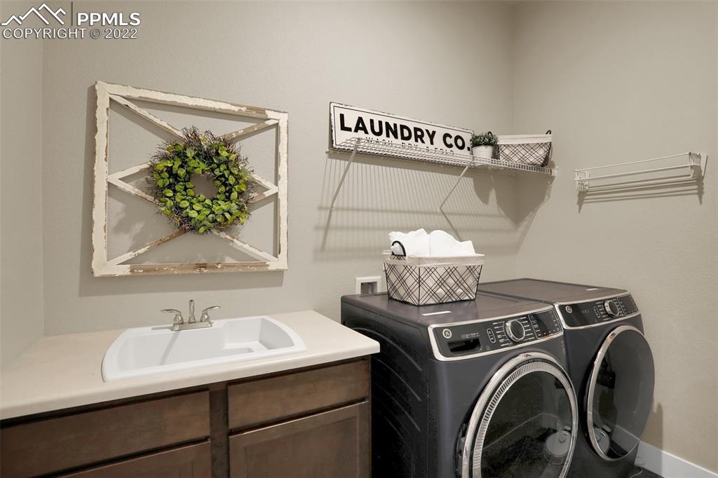 1435 Catnap Lane Monument, CO 80132 - Photo 20 of 47 a utility room with dryer and washer