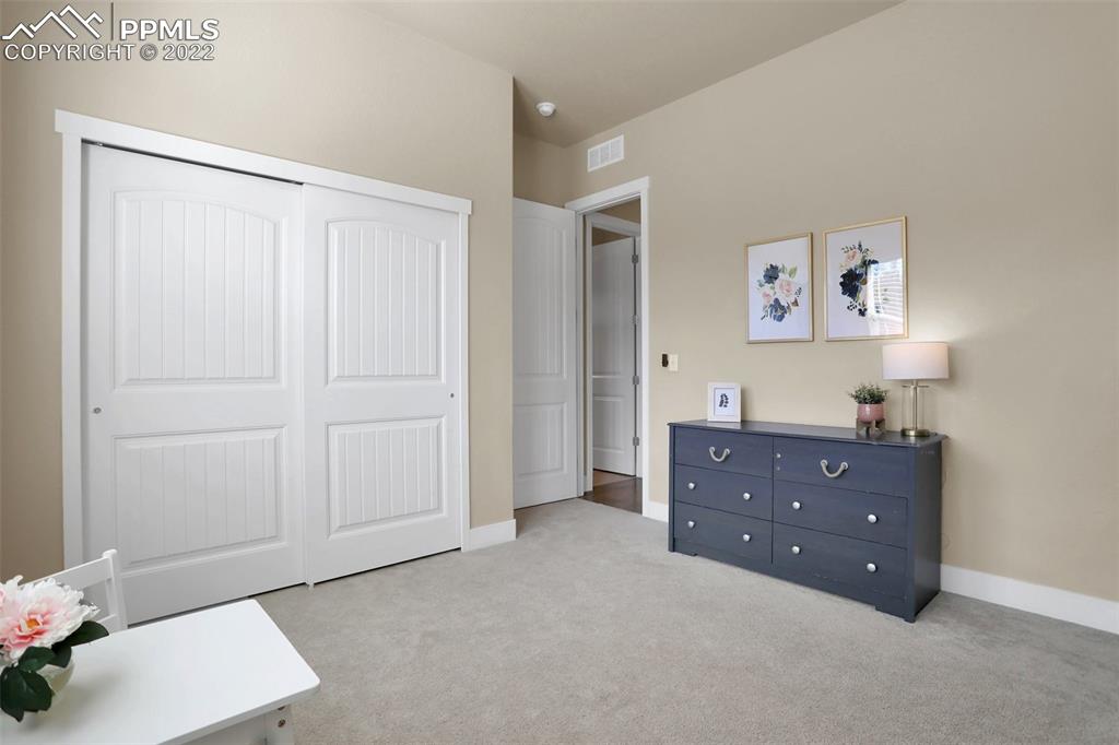 1435 Catnap Lane Monument, CO 80132 - Photo 24 of 47 a room with a dresser and a window