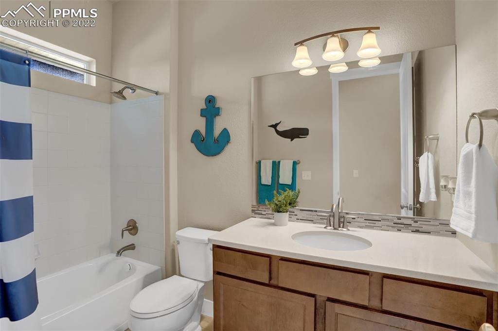 1435 Catnap Lane Monument, CO 80132 - Photo 25 of 47 a bathroom with a sink a toilet and shower