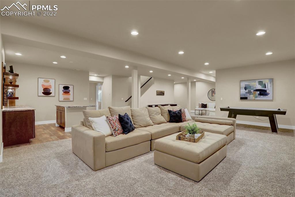 1435 Catnap Lane Monument, CO 80132 - Photo 28 of 47 a living room with furniture and a large window
