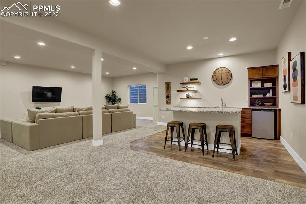 1435 Catnap Lane Monument, CO 80132 - Photo 29 of 47 a large kitchen with a table and chairs