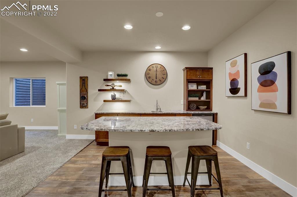 1435 Catnap Lane Monument, CO 80132 - Photo 30 of 47 a view of kitchen island with furniture and window