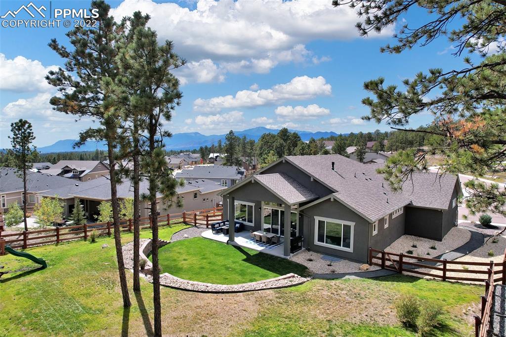 1435 Catnap Lane Monument, CO 80132 - Photo 3 of 47 a aerial view of a house with garden space and street view