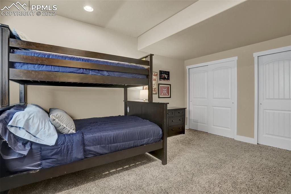 1435 Catnap Lane Monument, CO 80132 - Photo 40 of 47 a bedroom with a bed and a window