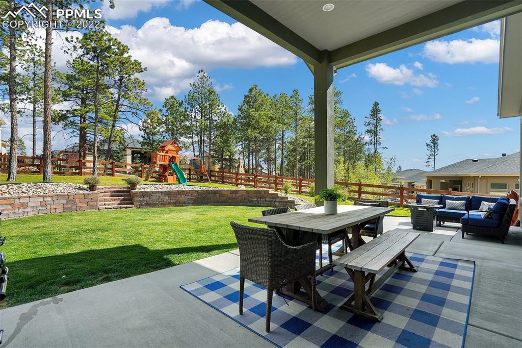 1435 Catnap Lane Monument, CO 80132 - Photo 43 of 47 a backyard of a house with outdoor seating