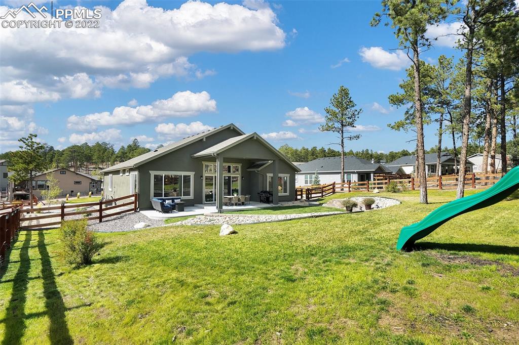 1435 Catnap Lane Monument, CO 80132 - Photo 45 of 47 a view of a house with swimming pool and sitting area