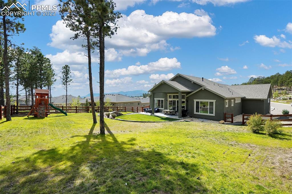 1435 Catnap Lane Monument, CO 80132 - Photo 46 of 47 a view of a house with swimming pool and sitting area