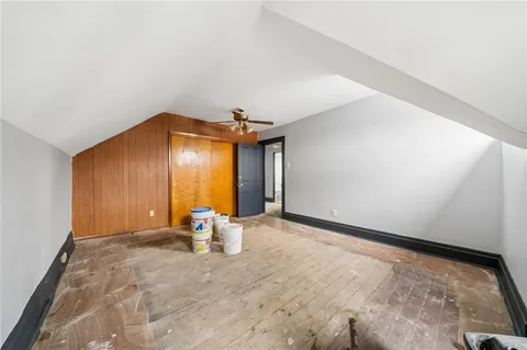 a view of empty room with a fireplace