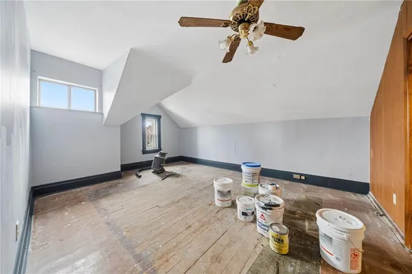 a view of a room with lounge chair and wooden floor