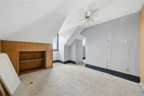 a view of an empty room with a fireplace