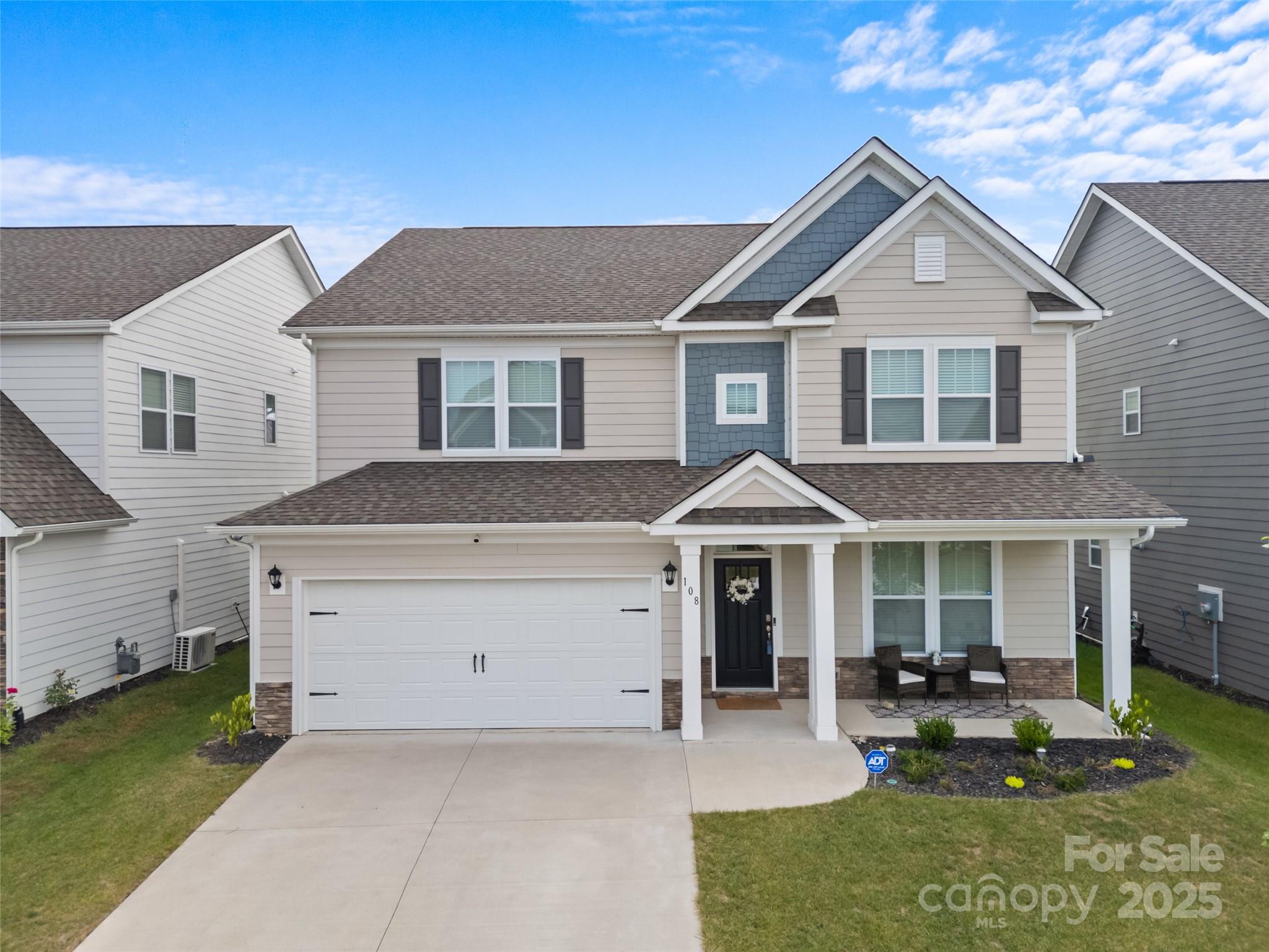 108 Thornberry Road Hendersonville, NC 28792 - Photo 1 of 42 a front view of a house with garden