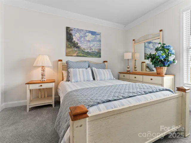 a bedroom with bed and window