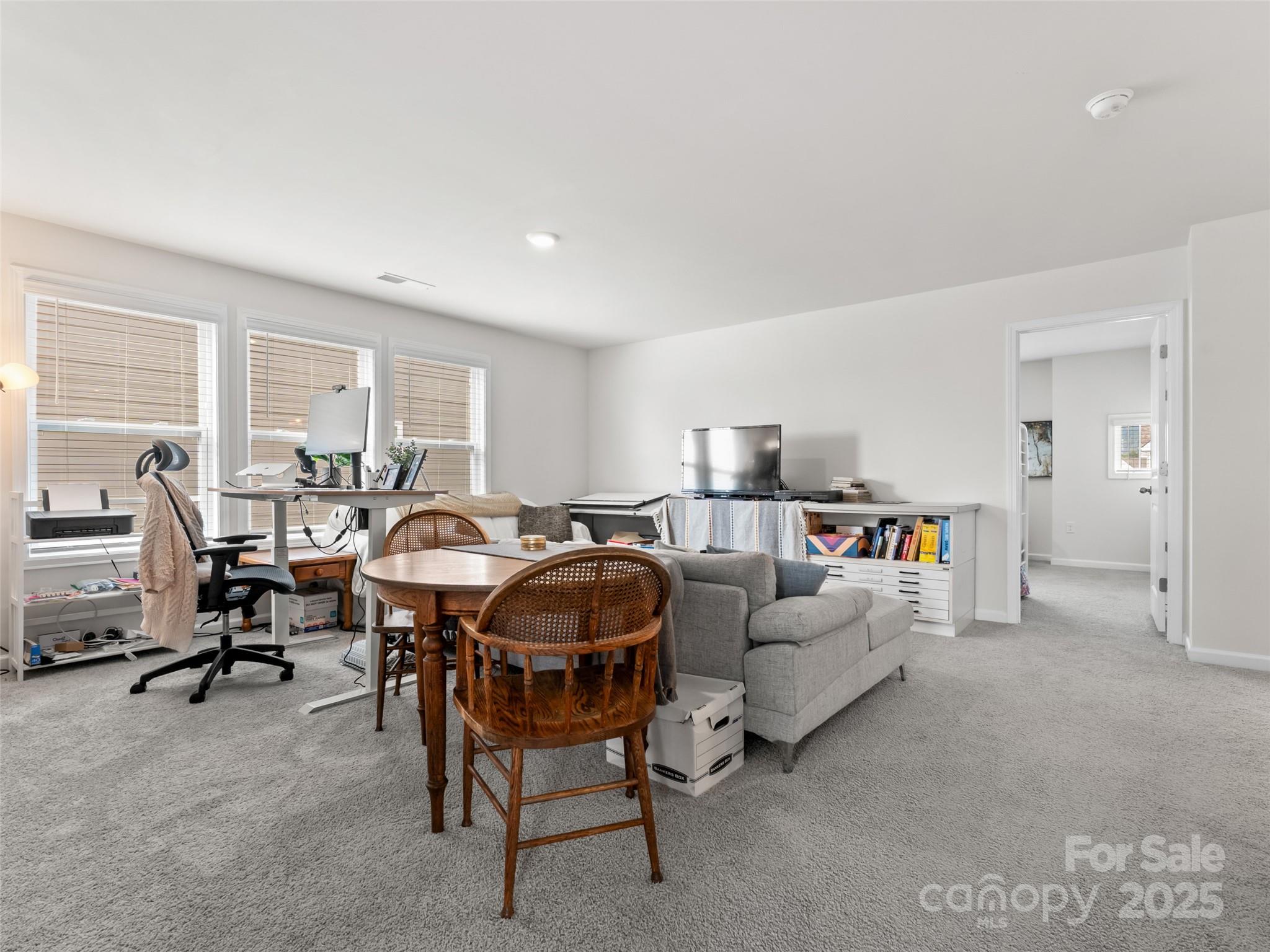 108 Thornberry Road Hendersonville, NC 28792 - Photo 16 of 42 a living room with furniture and a large window