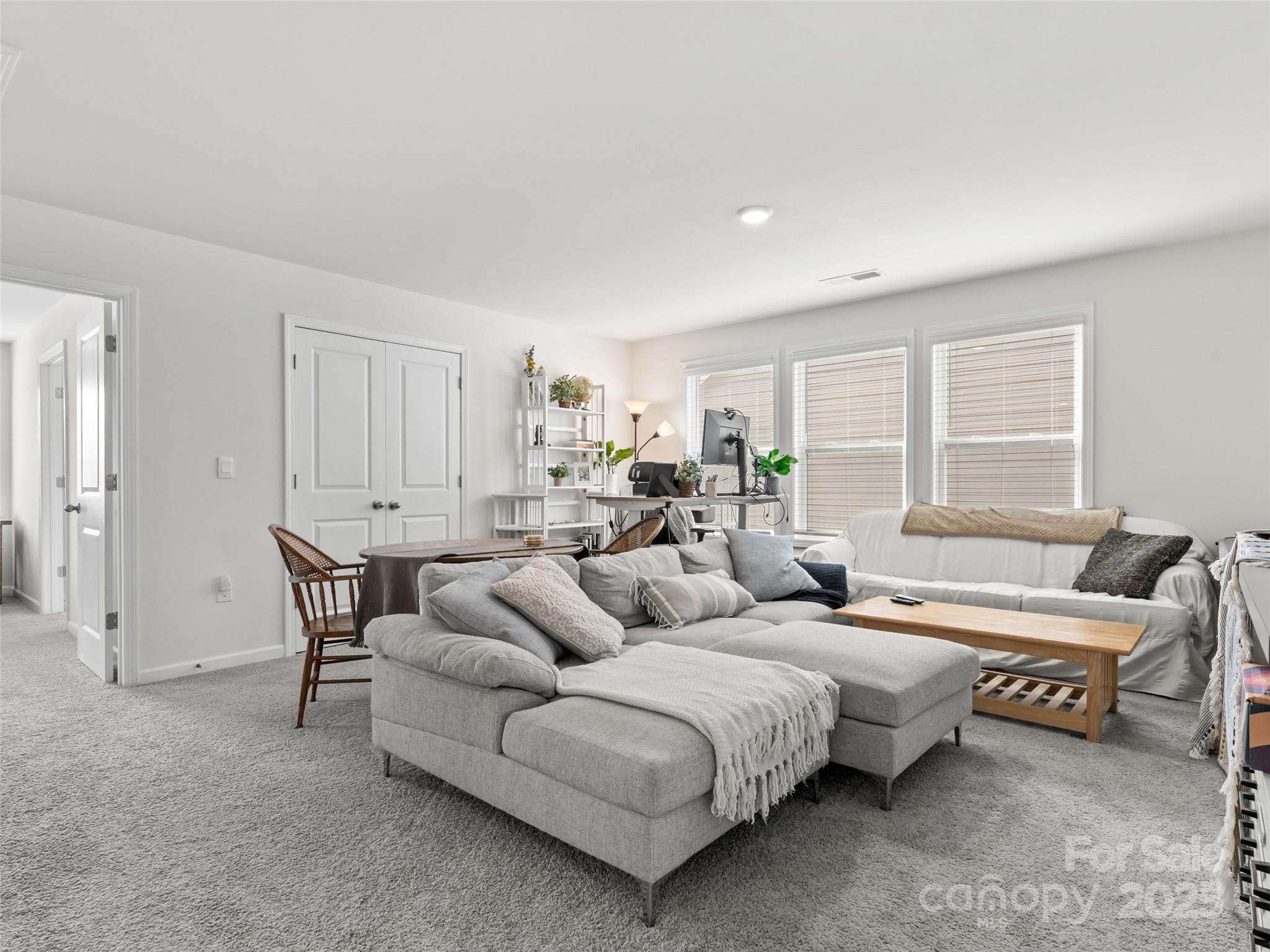 108 Thornberry Road Hendersonville, NC 28792 - Photo 17 of 42 a living room with furniture and a window