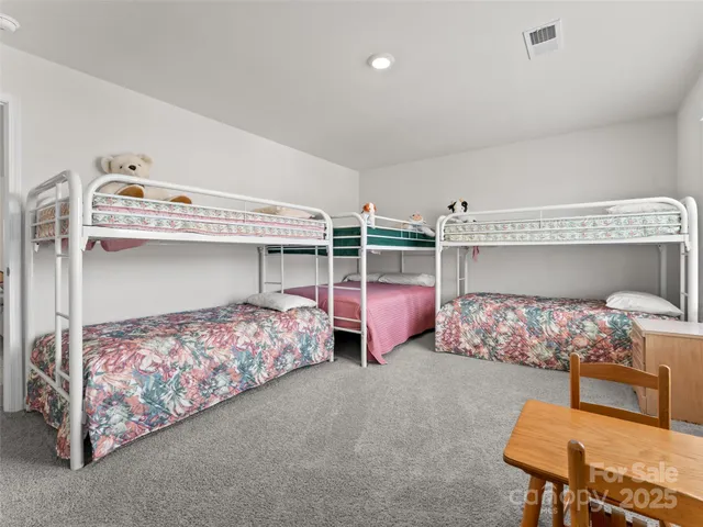 a bedroom with bed and window