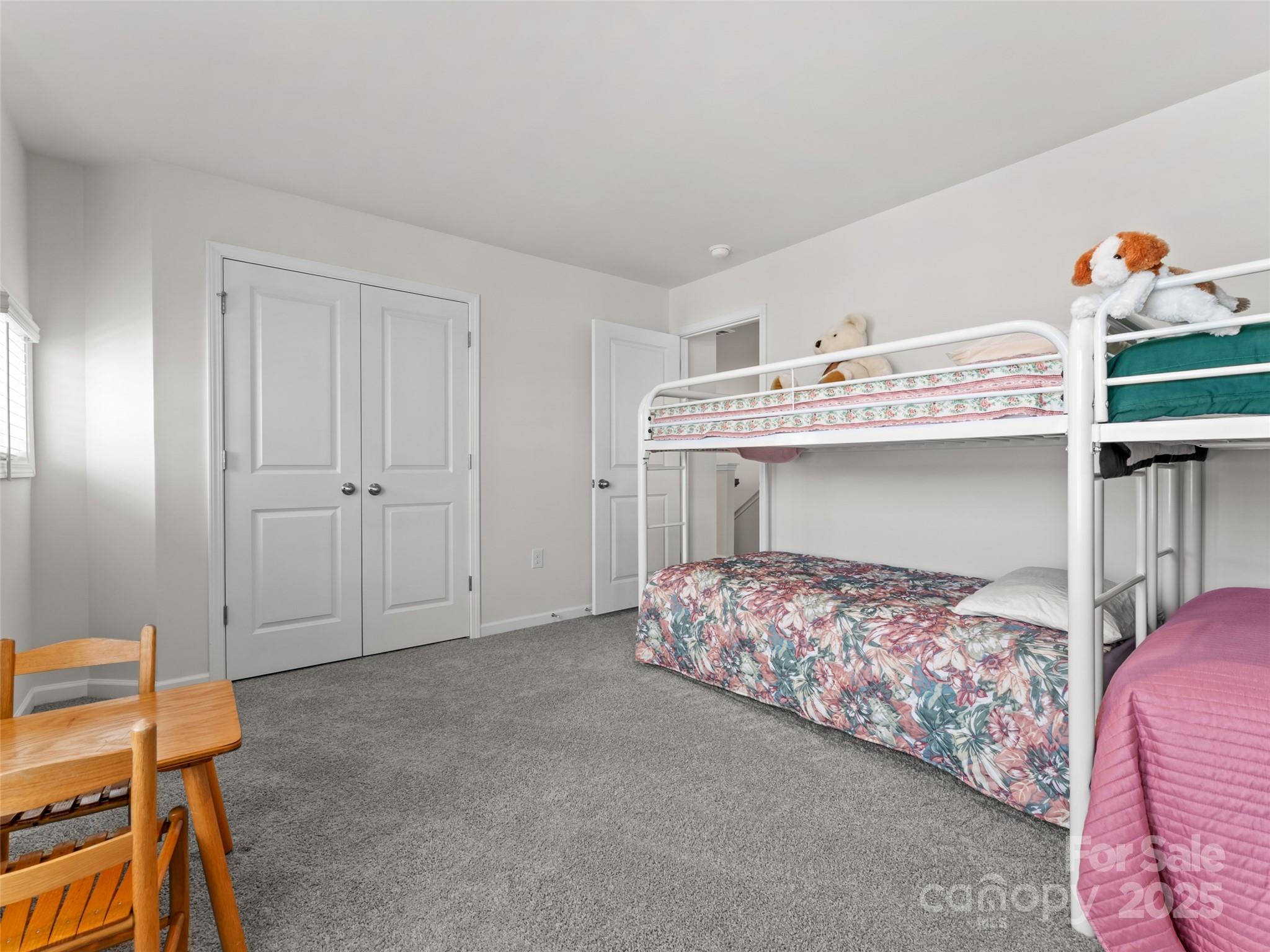 108 Thornberry Road Hendersonville, NC 28792 - Photo 19 of 42 a bedroom with a bed and a table