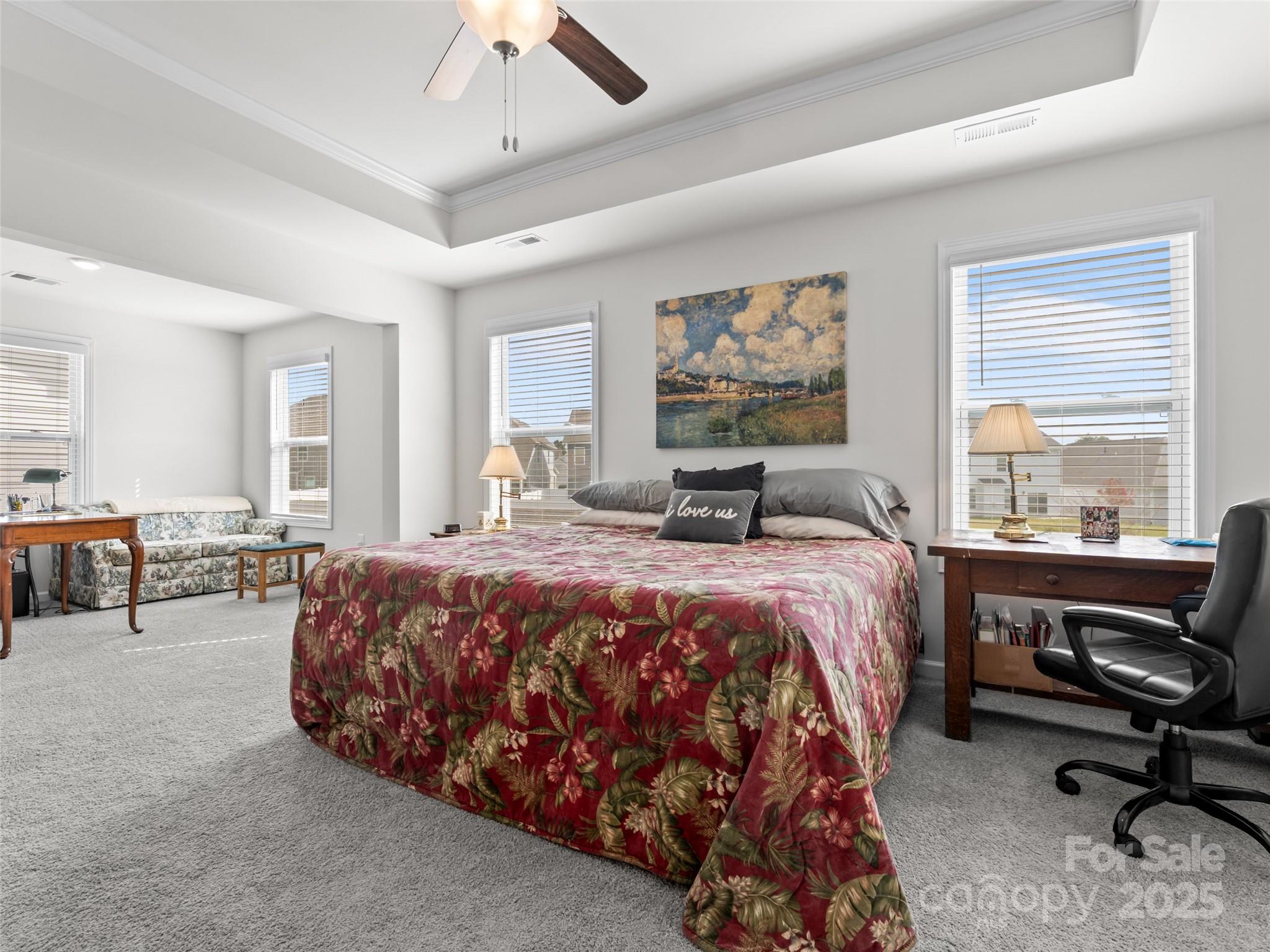 108 Thornberry Road Hendersonville, NC 28792 - Photo 20 of 42 a bedroom with a bed and a chandelier