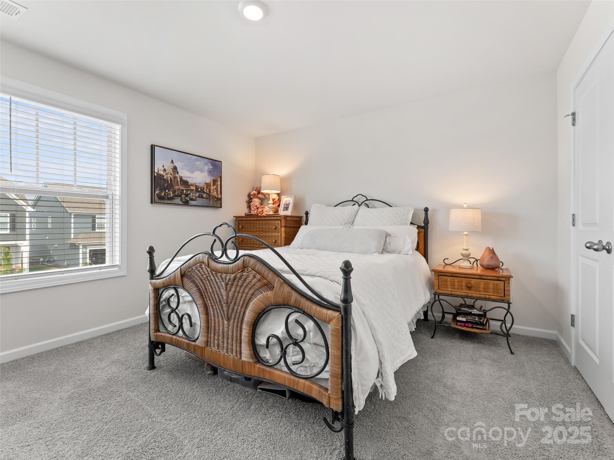 108 Thornberry Road Hendersonville, NC 28792 - Photo 26 of 42 a bedroom with a bed and a window