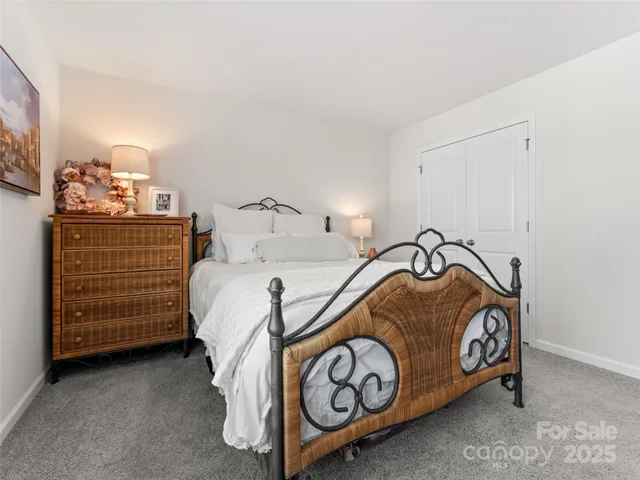 a bedroom with a bed and dresser