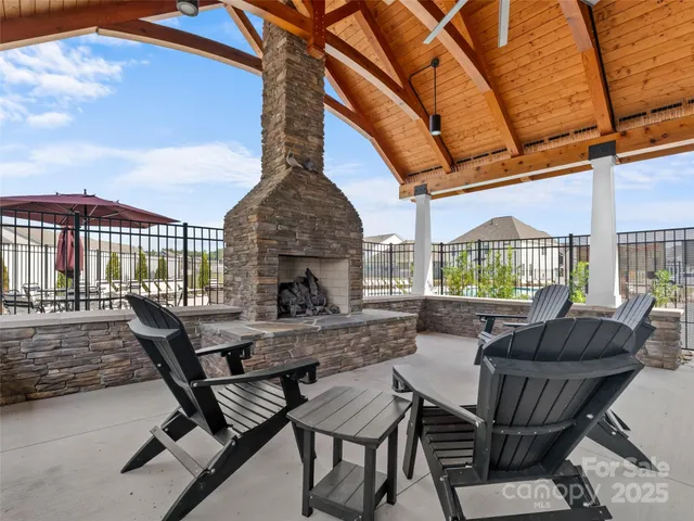 a view of a patio with a table and chairs