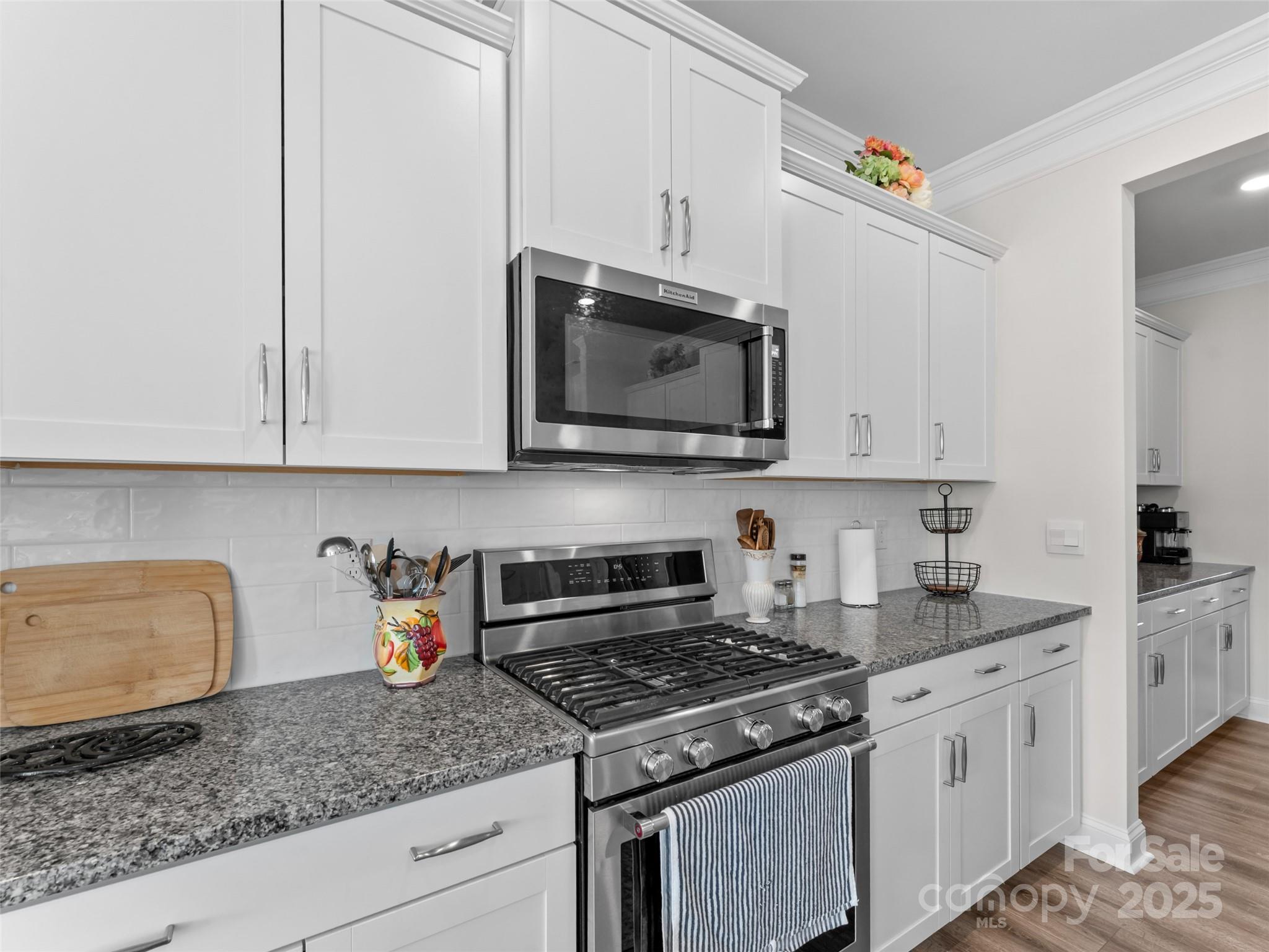108 Thornberry Road Hendersonville, NC 28792 - Photo 7 of 42 a kitchen with stainless steel appliances granite countertop a sink stove and microwave