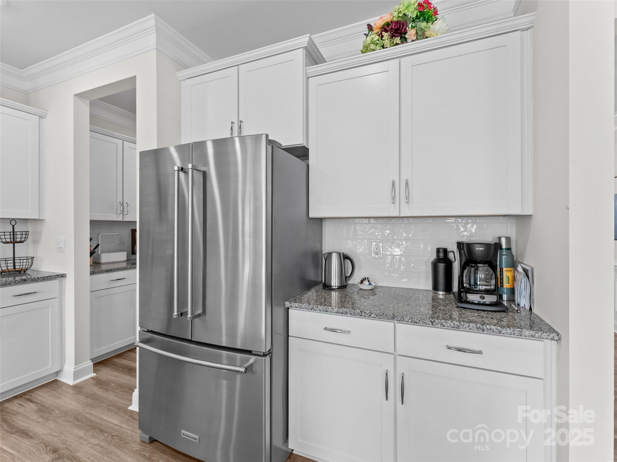 108 Thornberry Road Hendersonville, NC 28792 - Photo 8 of 42 a kitchen with refrigerator and cabinets