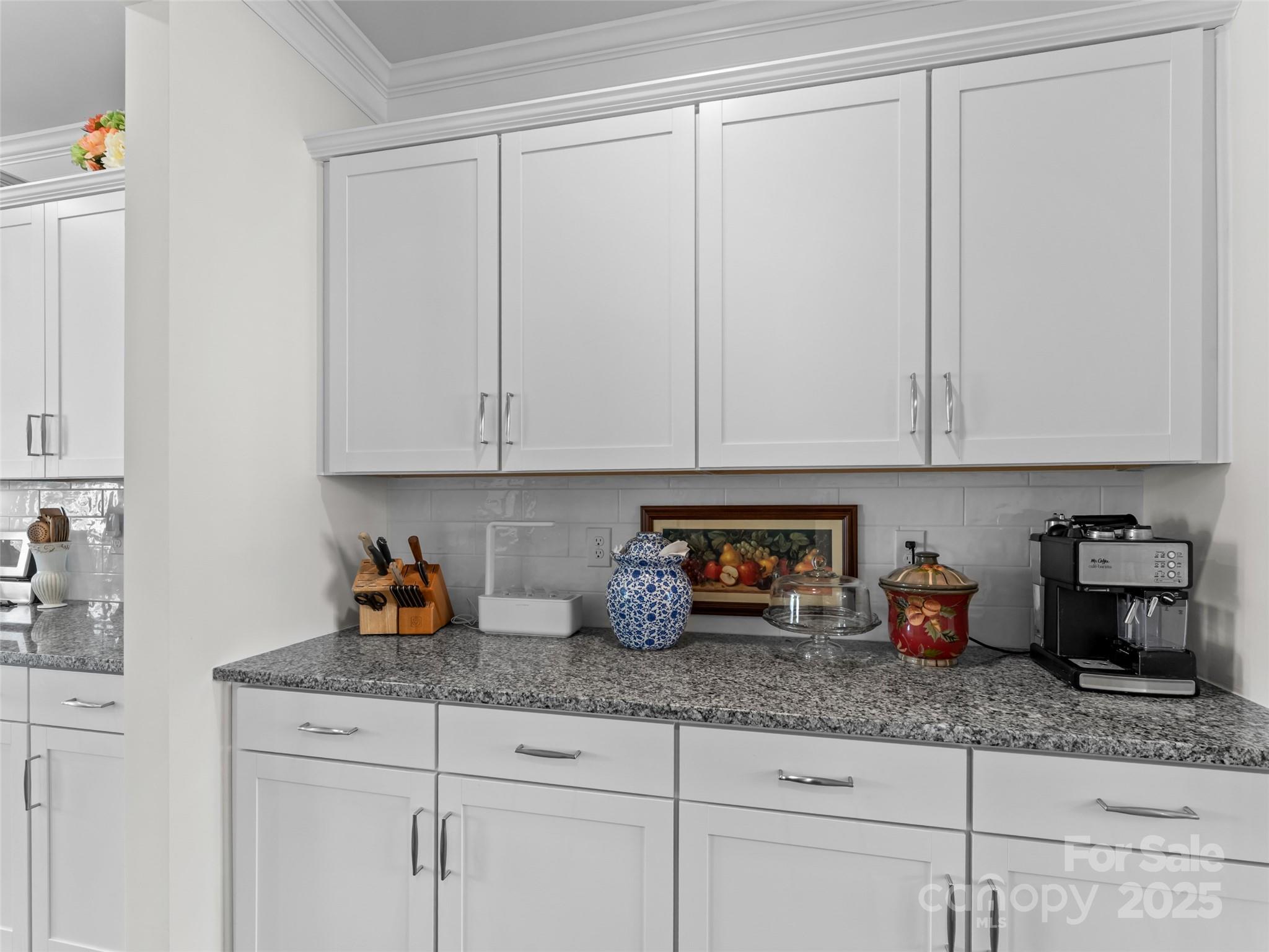 108 Thornberry Road Hendersonville, NC 28792 - Photo 9 of 42 a kitchen with granite countertop white cabinets and a sink