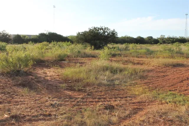 a view of a lake with houses in the back