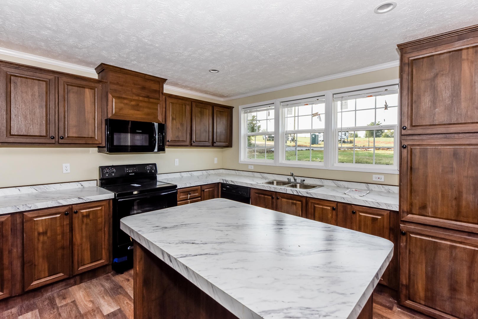 207 South Springview Road Maryville, TN 37801 - Photo 8 of 34 a kitchen with stainless steel appliances granite countertop wooden cabinets a stove top oven a sink and dishwasher