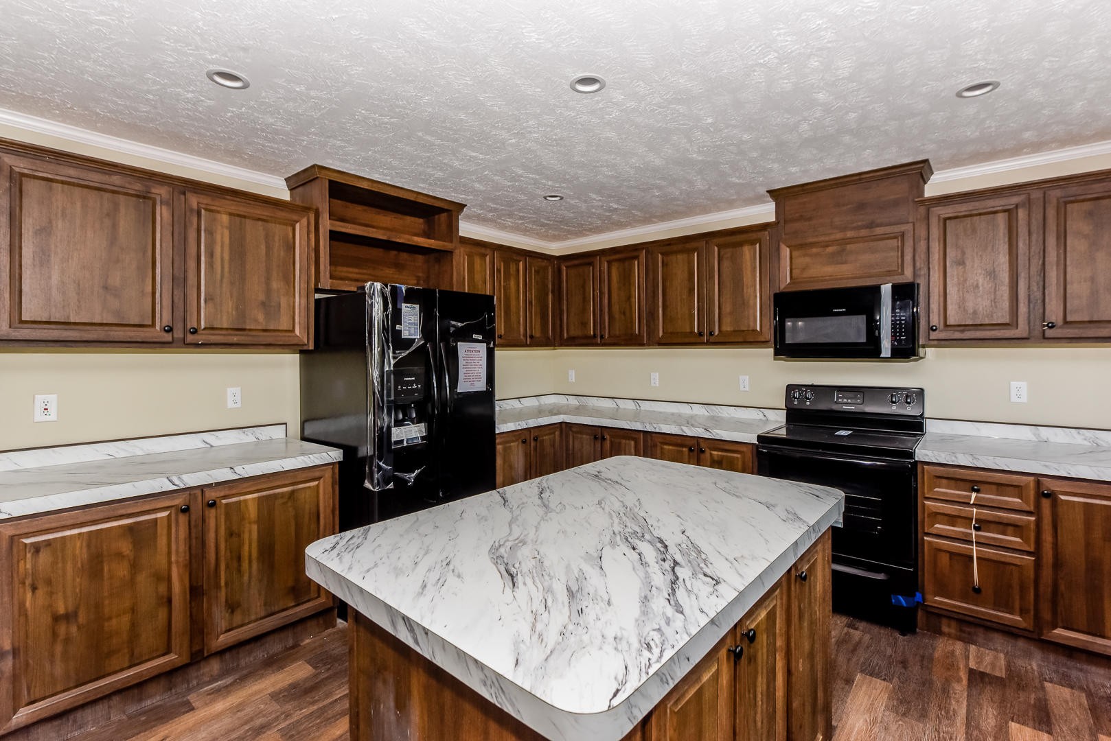 207 South Springview Road Maryville, TN 37801 - Photo 9 of 34 a kitchen with a stove a sink and a refrigerator
