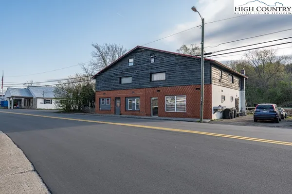 a front view of a building with a road