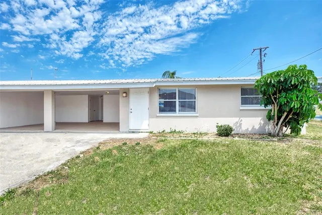 a house view with a backyard space