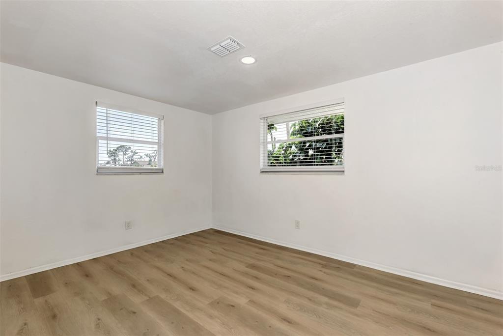 1601 Faust Drive, Unit B Englewood, FL 34224 - Photo 9 of 19 an empty room with a window