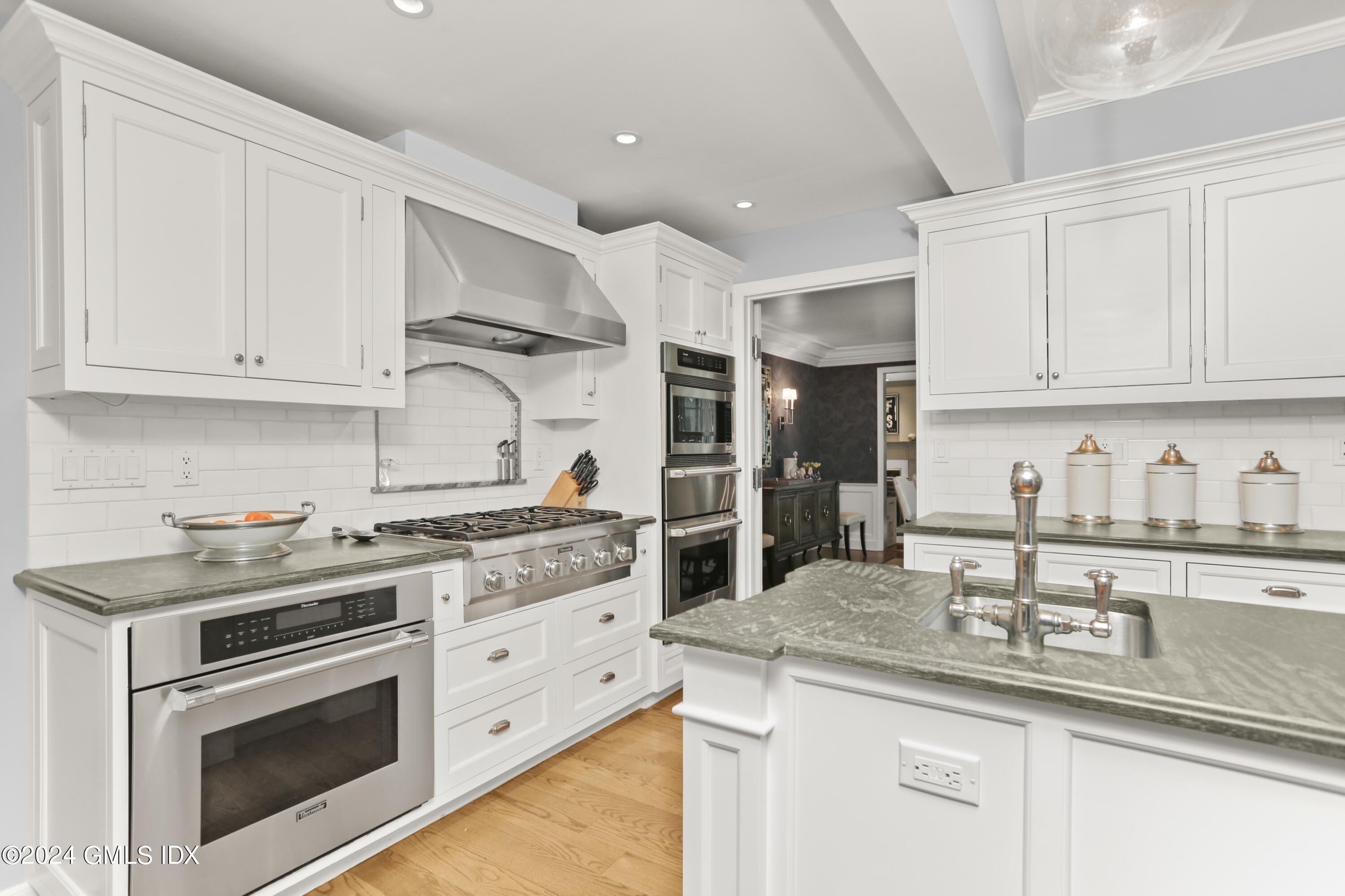 30 Ridgebrook Road Greenwich, CT 06830 - Photo 7 of 33 a kitchen with stainless steel appliances granite countertop a sink stove and cabinets