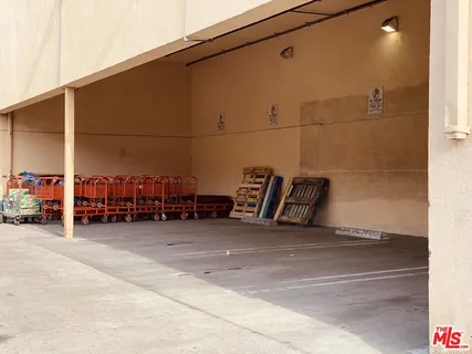 a view of storage and utility room with a window