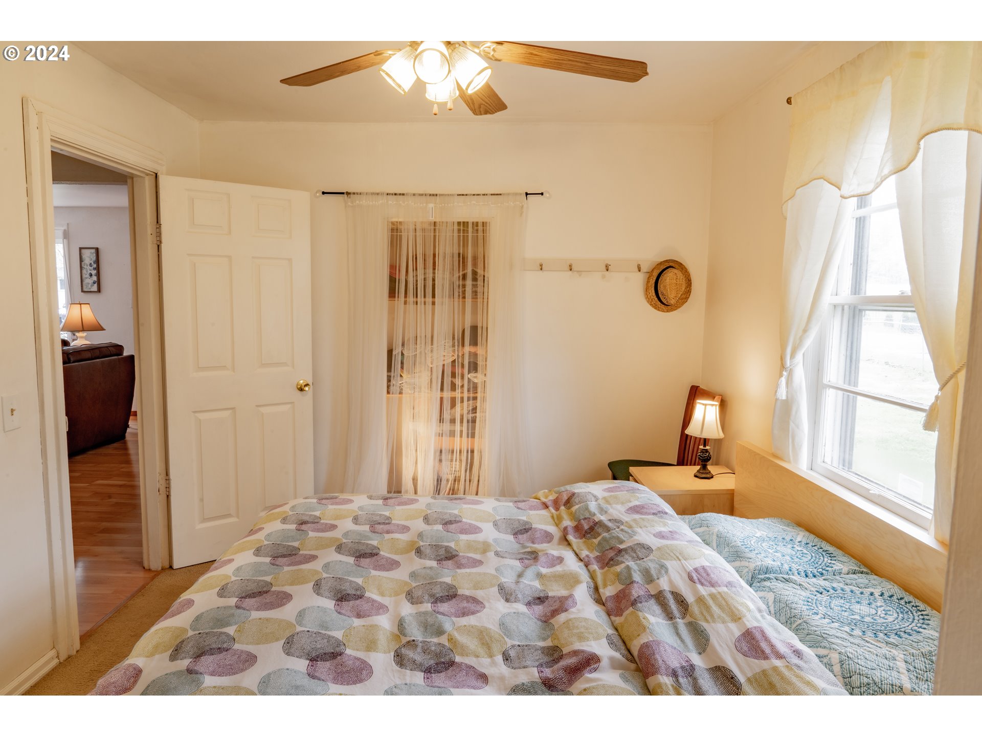 17141 Southeast Stephens Street Portland, OR 97233 - Photo 14 of 27 a bedroom with a bed and a window