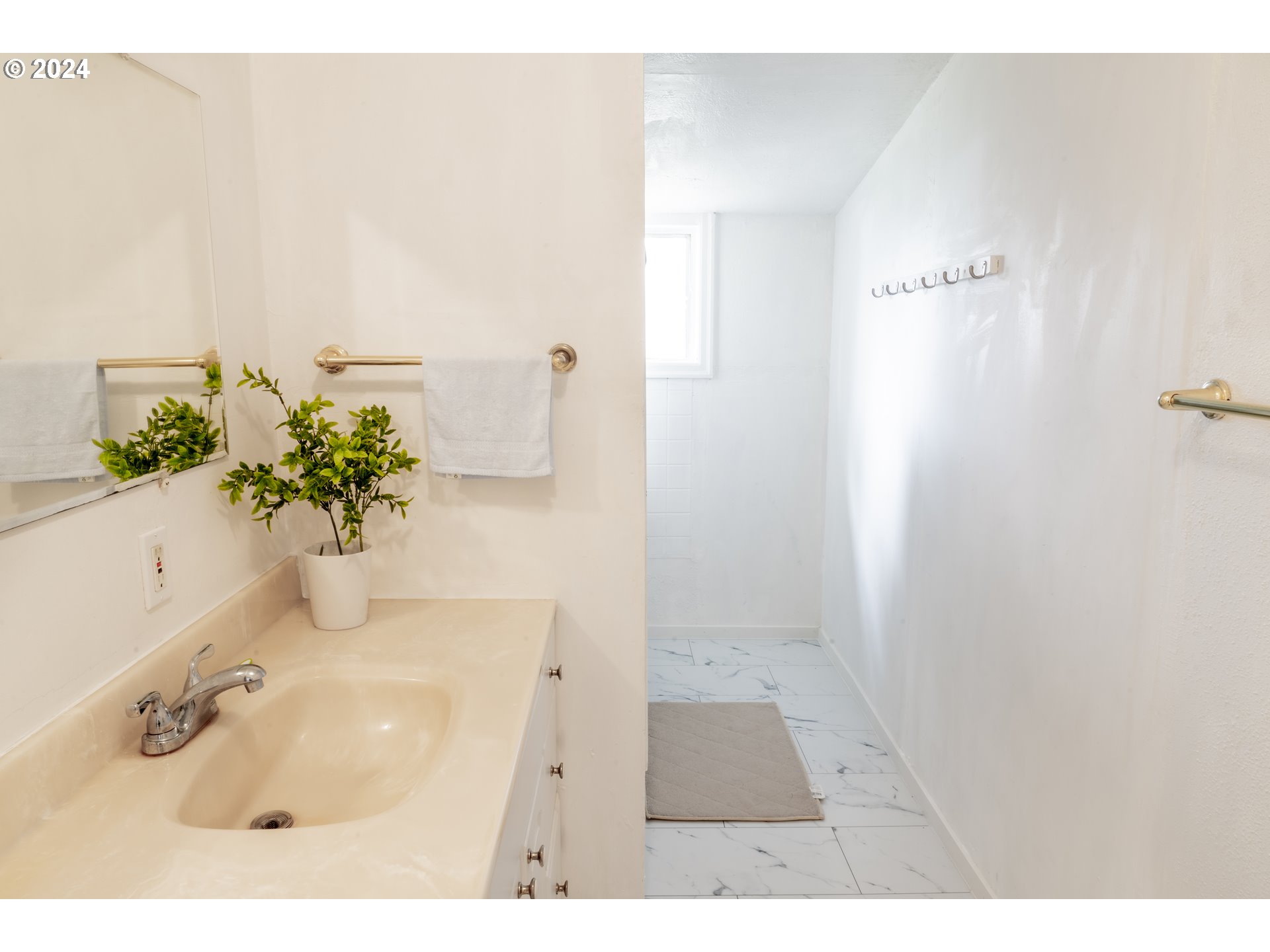 17141 Southeast Stephens Street Portland, OR 97233 - Photo 16 of 27 a bathroom with a sink a mirror and a shower