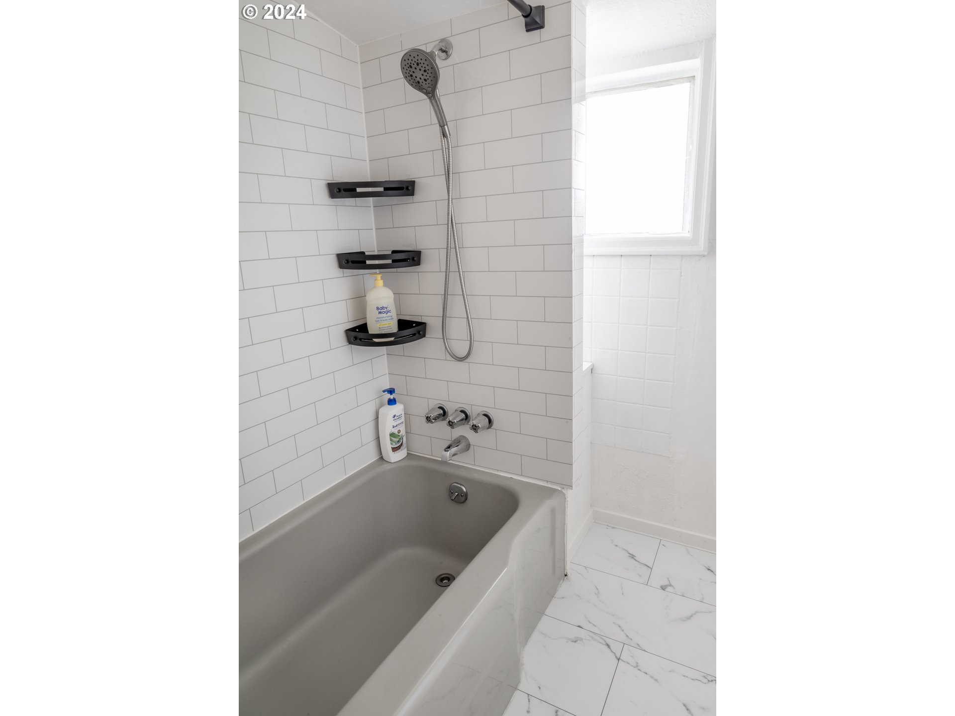 17141 Southeast Stephens Street Portland, OR 97233 - Photo 17 of 27 a bathroom with a bathtub and a sink