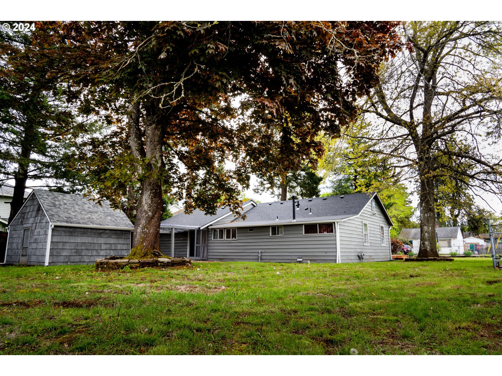 17141 Southeast Stephens Street Portland, OR 97233 - Photo 26 of 27 a view of a house with a backyard