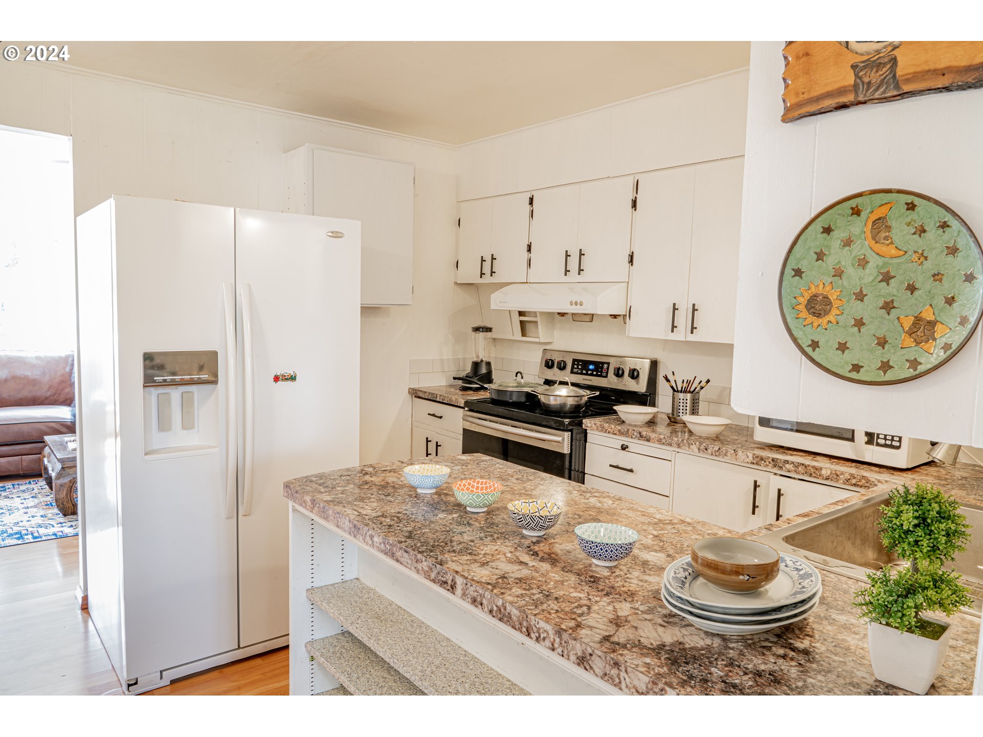 17141 Southeast Stephens Street Portland, OR 97233 - Photo 9 of 27 a kitchen with stainless steel appliances granite countertop a refrigerator and a stove