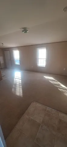 a view of a kitchen with furniture and a kitchen