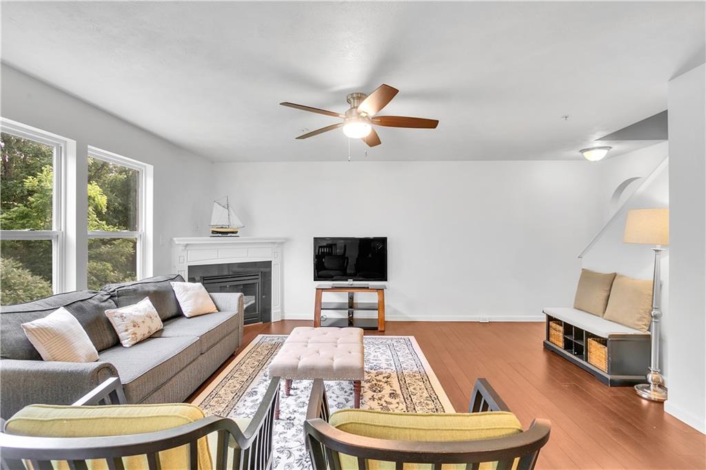 6439 Lindsey Lane Export, PA 15632 - Photo 14 of 39 a living room with furniture and a fireplace