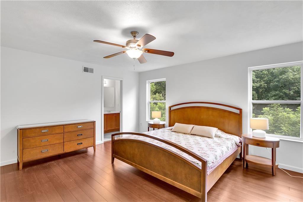 6439 Lindsey Lane Export, PA 15632 - Photo 24 of 39 a bedroom with a bed a window and dresser