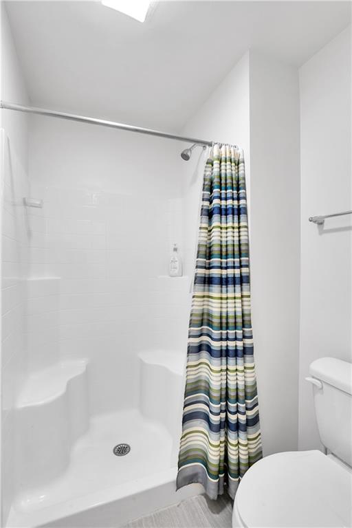 6439 Lindsey Lane Export, PA 15632 - Photo 26 of 39 a bathroom with a bathtub and shower