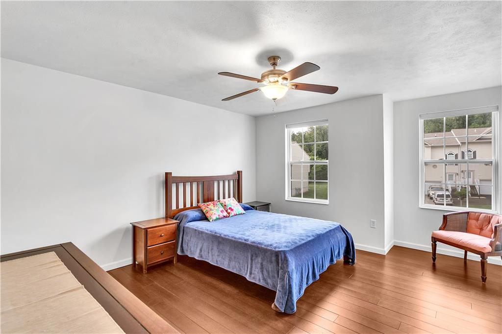 6439 Lindsey Lane Export, PA 15632 - Photo 32 of 39 a bedroom with a bed bookshelf and a window